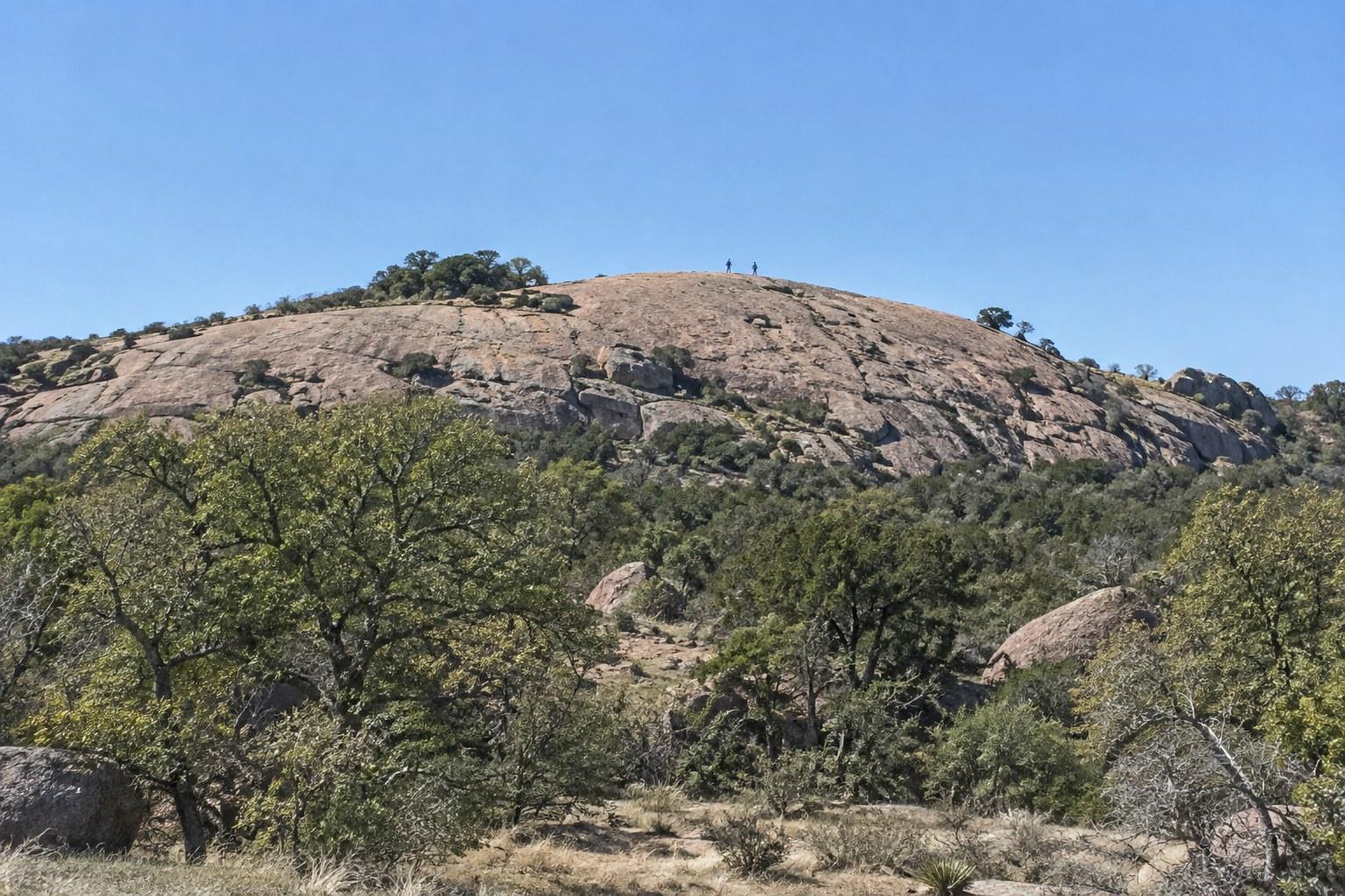 Pink granite dome of Enchanted Rock State Natural Area near Fredericksburg, TX