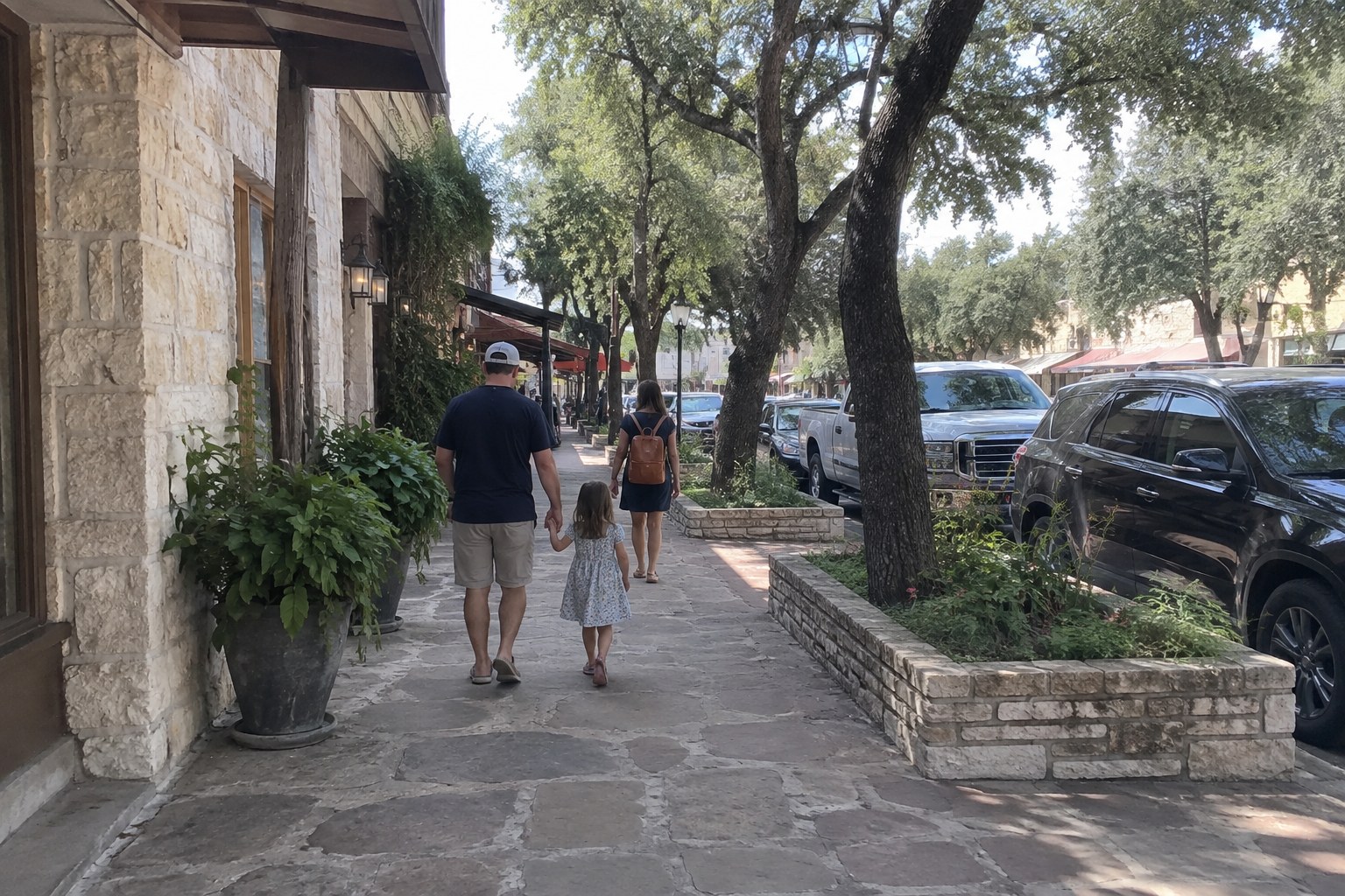 Family walking along Main Street in Fredericksburg, TX with kids